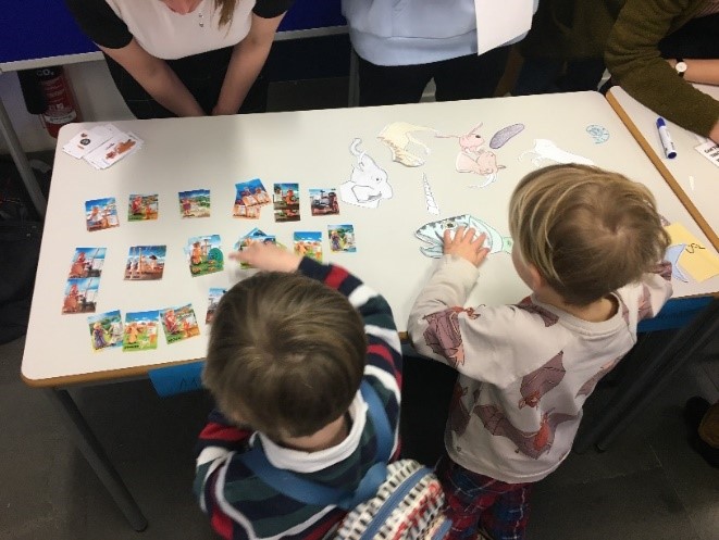 children playing with cards on a table